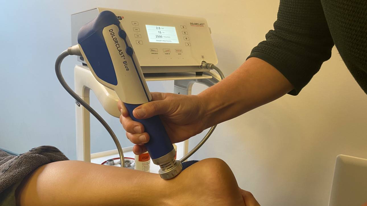 Shockwave equipment being used on achilles tendon